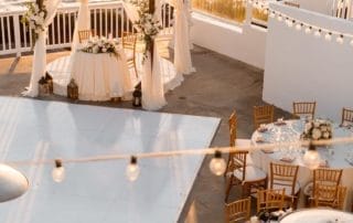 A wedding reception set up on a deck overlooking the ocean in Laguna Beach, one of the stunning wedding venues in Southern California.
