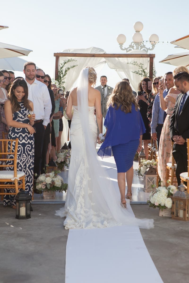 A bride and groom walking down the aisle at a beautiful outdoor wedding in Southern California.