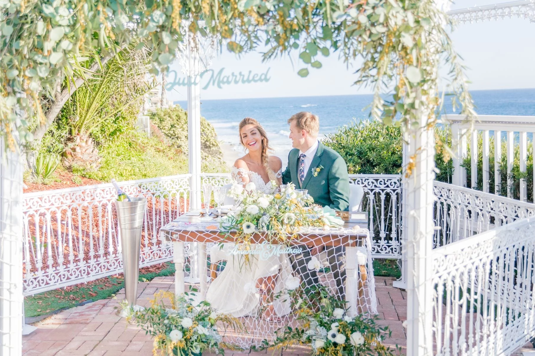 Laguna Beach SSAA Styled Shoot_0426 A bride and groom enjoying their special day at a table by the stunning ocean views of Laguna Beach, one of the finest Southern California wedding venues.