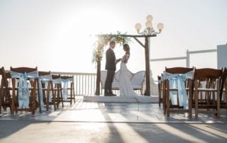 A bride and groom standing in front of a wedding ceremony at one of the beautiful wedding venues in Southern California or Laguna Beach.