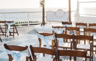 A stunning wedding ceremony set up on a picturesque terrace overlooking the breathtaking ocean in one of the most sought-after wedding venues in Laguna Beach.