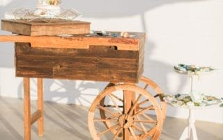 A rustic wooden cart showcasing a delectable cake, ideal for weddings venues in Southern California.