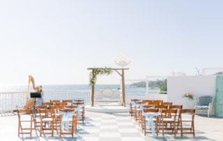 A breathtaking wedding ceremony set up on a scenic deck overlooking the ocean in Laguna Beach, Southern California.